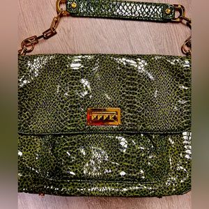 Torn Burch green purse